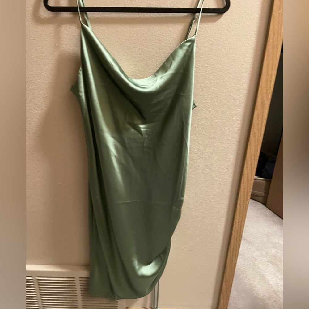 Satin sage green cowl neck midi slip dress with cinching on side. Size M